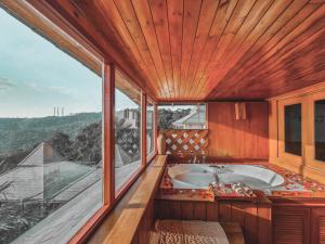 Large bathroom with tub and window
