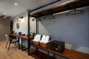 A room with a desk and a loft bed at P2 Wood Loft in Phi Phi Islands