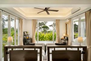 a bedroom with a bed and a ceiling fan at Shantaa Resort, Kohkood in Ko Kood