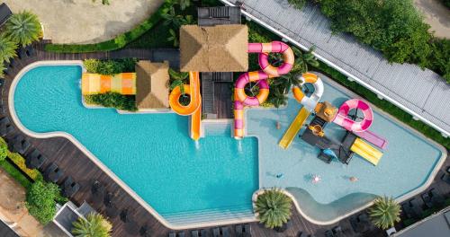 An overhead view of a pool with a water park at The Splash Koh Chang in Koh Chang