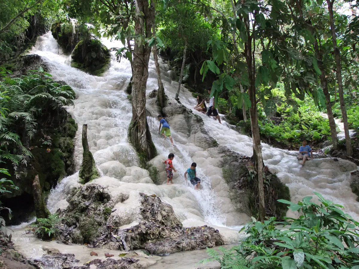 Climbing the limestone Bua Tong Sticky Waterfall