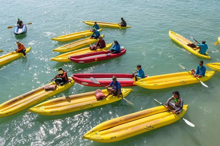 Guides gather in preparation for a sun-soaked tour of Phang Nga Bay’s waters.