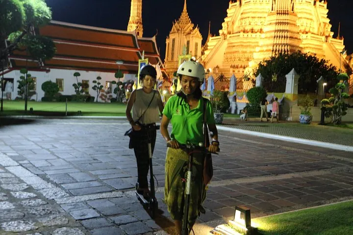 Wat Arun on an e scooter