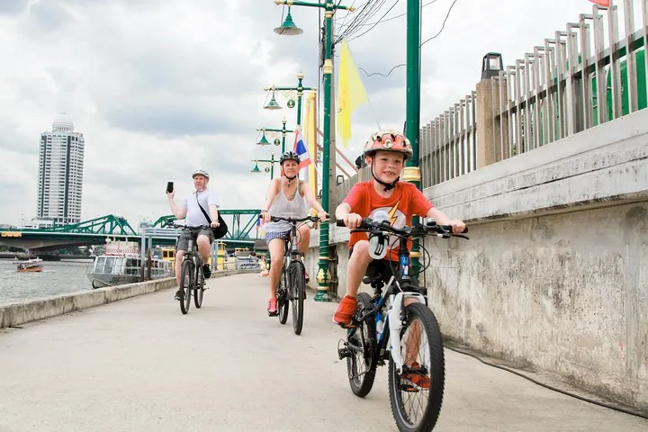 Cycling over the bridge cross Chao Phraya river