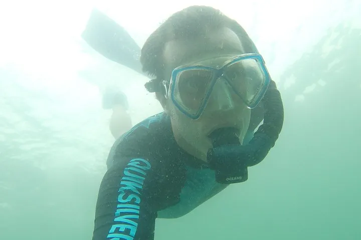 Diving down under the water.