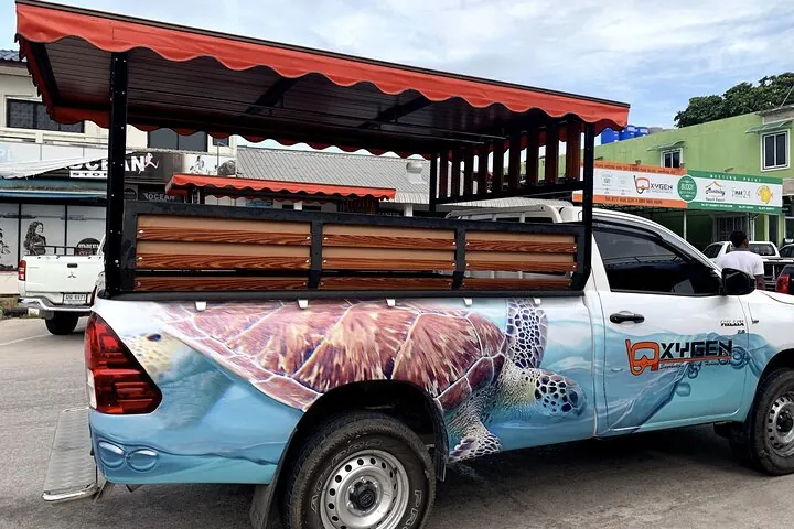 Get picked up from your hotel on Koh Tao by local truck