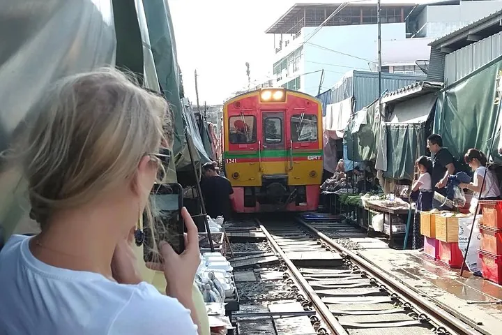 Train passing Maeklong railway market